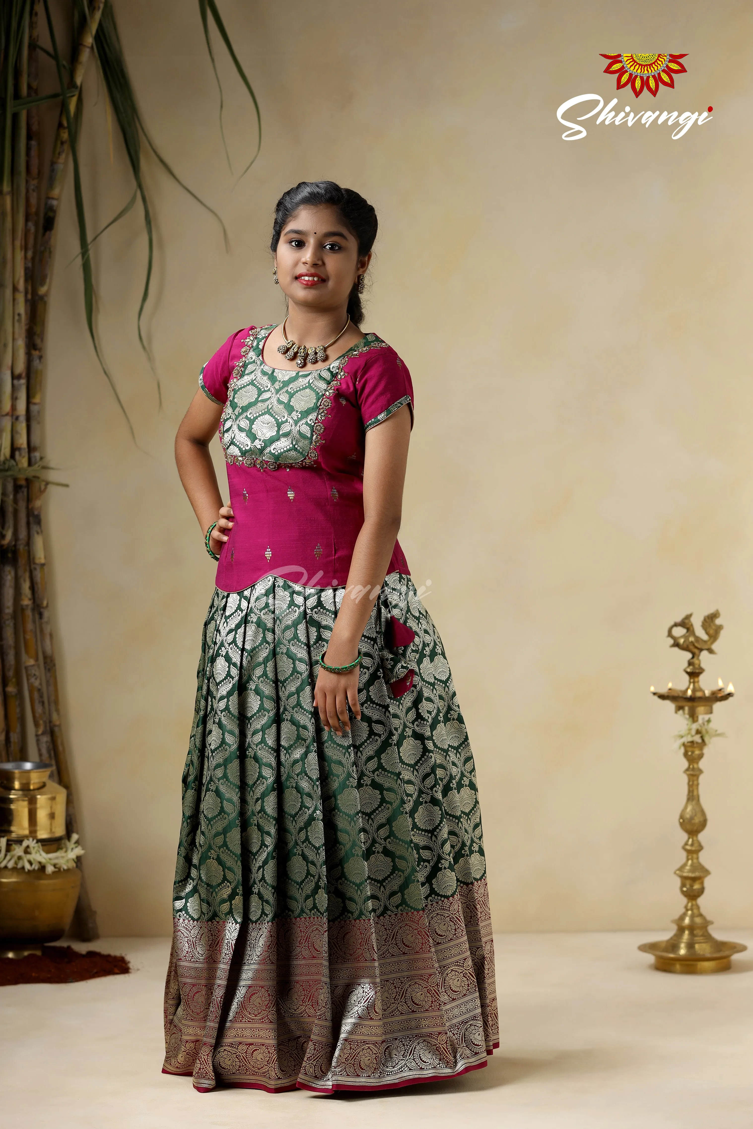 Embroidery Pattu Pavadai Designs for Girls - Green Satin Diya